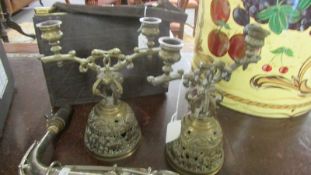 A pair of Victorian brass bell candelabra.