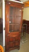 An oak corner cabinet. COLLECT ONLY.