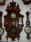 An ornate Victorian twin weight Vienna wall clock with mirrored adornments. COLLECT ONLY.