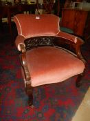 An Edwardian arm chair.