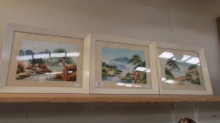 Three framed and glazed mountain scenes on silk.