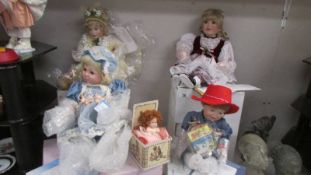 Two Ashton Drake dolls, A Hamilton doll and a McMemories doll.