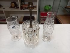 2 cut glass candle lamps and a cut glass table lamp