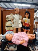 A collection of large vintage plastic dolls including walkers, and Puss in Boots teddy and Armand