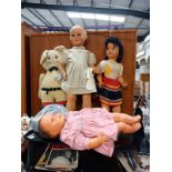 A collection of large vintage plastic dolls including walkers, and Puss in Boots teddy and Armand