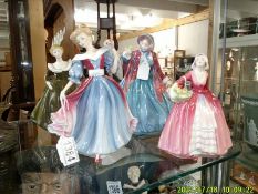 Four Royal Doulton figurines - Janet HN1537, Geraldine HN2348, Lady Charmaine HN1948 & Amy HN 3316.