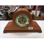 An oak mantle clock