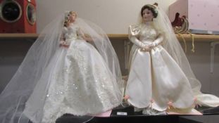Two Ashton Drake bride dolls.