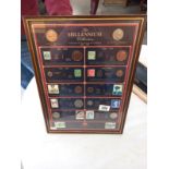 A framed Millenium collection 100 years of history 1900-2000 coins and stamps.