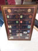 A framed Millenium collection 100 years of history 1900-2000 coins and stamps.