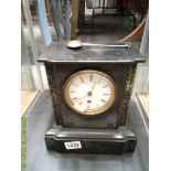 A black slate mantel clock.