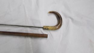 An old cane sword stick with horn handle, 90 cm, blade 58 cm.