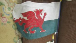 A vintage Wales flag on pole, 94 x 33 cm, pole 112 cm.