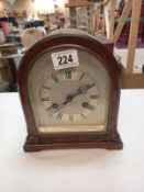 A bracket mantle clock with silvered dial, dedicated and dated 1929. Height 23cm