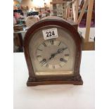 A bracket mantle clock with silvered dial, dedicated and dated 1929. Height 23cm