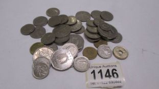 A quantity of Malta coins.