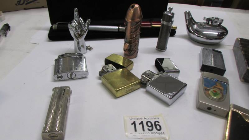 A collection of cigarette lighters including Zippo, novelty and two old pens. - Image 3 of 3