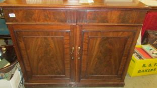 A mahogany two door cabinet. COLLECT ONLY.