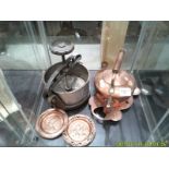 A copper kettle, a brass trivet, 2 brass pin trays and an old tongue press.