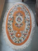 An old Chinese oval carpet