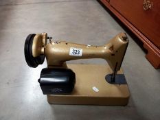 A retro Singer sewing machine Cat no CBK 2-12 needs rewiring and drive belt