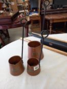 A set of 3 graduated copper cider measures