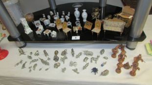 A mixed lot including doll house furniture, German miniature wooden figures and metal figures