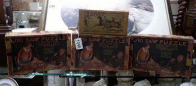Three vintage wooden jigsaw puzzles and a horse racing game.