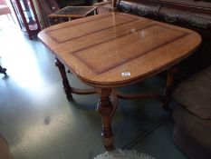 An oak drawer leaf table