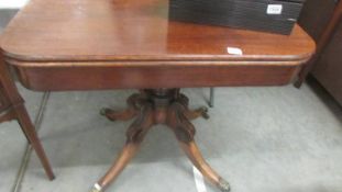 A mahogany fold over games table. COLLECT ONLY.
