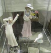 Two NAO figures and a Lladro goose.