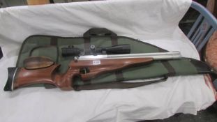 A Ripley ARSS polished action with 6 x 24 x 50 scope and case.
