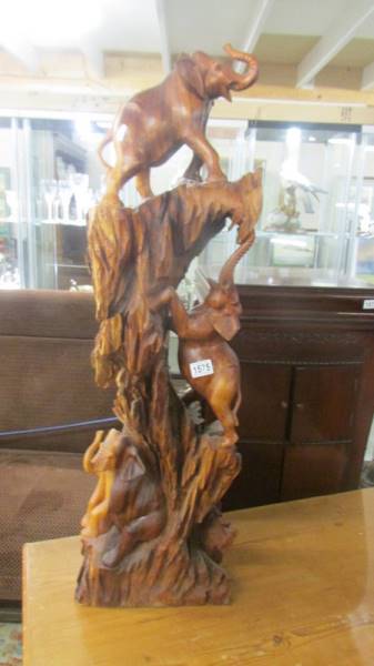 A hardwood elephant carving. COLLECT ONLY.