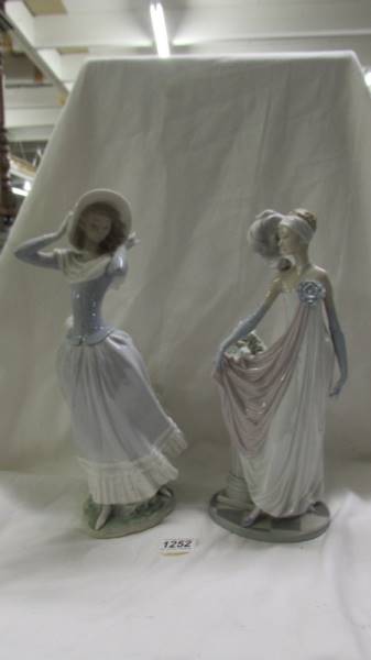 A 1920's style Lladro flapper lady and another Lladro lady.