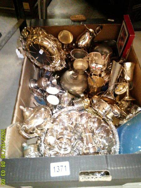 A large lot of silver plate including cruets, goblets, dishes, trays, vases etc.,