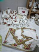 15 pieces of Royal Albert Old Country Roses pin dishes, cased set spoons etc., tablecloth & napkins.