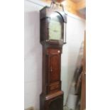 A tall oak cased early 19th century long case clock with painted dial and shell inlay. COLLECT ONLY.