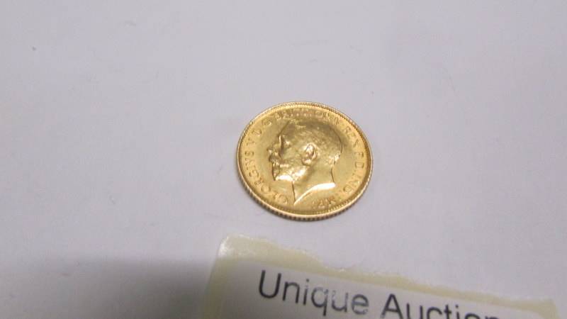 A gold 1915 half sovereign. - Image 2 of 2