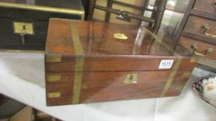 A mahogany brass bound writing box.