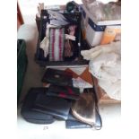 A collection of ladies gloves and handbags