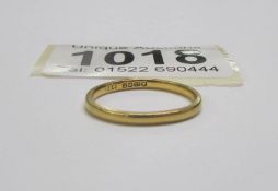 A 22 carat gold wedding ring, size J, 2 grams.
