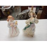 A pair of Doulton figures