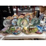Approximately 27 boxed collectors plates including Bradford Exchange, trains, oriental scene etc