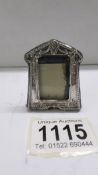 A miniature silver photo frame, 5 x 4 cm.