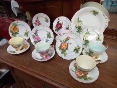 A set of 6 world famous roses tea set trios by Paragon, and serving plate