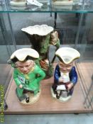 A Withernsea jug, a musical Toby jug and another Toby jug.