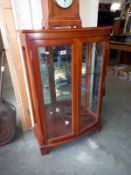 A mahogany cut glass display cabinet