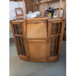 An Edwardian oak cabinet