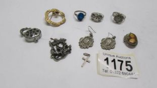 Three vintage silver rings, a pair of early 20th century earrings and other items.