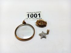 An Edwardian garnet and pearl gold brooch, a 9ct gold star pendant and a gold plated photo fob.